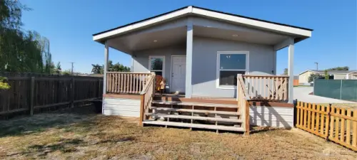 Front Porch with a cozy and private deck with a fenced yard.