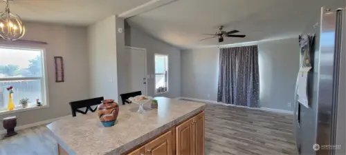 The Dining areas and Living Room from the Kitchen.