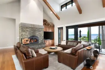 Open concept with wood-burning fireplace and built-in cabinets for the entertaining space. Ready for the next owner to use as a weekend retreat or summer home.