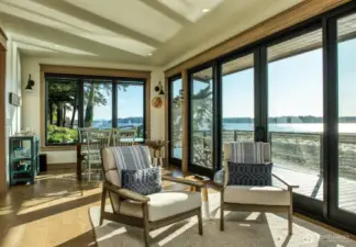 Step inside this serene guest cabana beach house retreat, where the panoramic views of Puget Sound become a part of your everyday. Elegant simplicity meets coastal charm, offering a haven where every window presents a postcard-worthy scene.