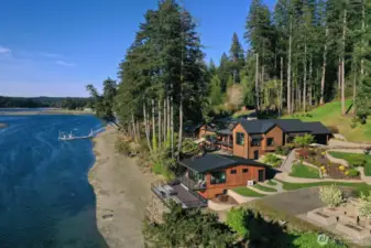 Five-acre low-bank waterfront estate is completely fenced and gated with a private cove for protected moorage.