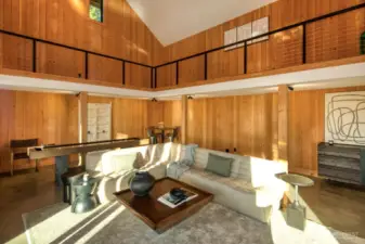 This expansive, light-filled studio space offers exceptional versatility with soaring ceilings, polished concrete floors, and warm wood finishes. Whether envisioned as a creative studio, game room, executive office, or an additional guesthouse, the open-concept layout and lofted mezzanine provide endless possibilities—all just steps from the main home on this stunning 5.4-acre waterfront estate. A truly flexible space designed to inspire.