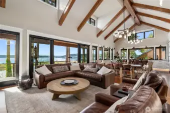 Open great room bathed in luxurious detailing and soaring ceiling with wall of windows to gardens and waterfront with views. Fir flooring with 7" VG Solid Decor is all elegantly designed throughout the home.