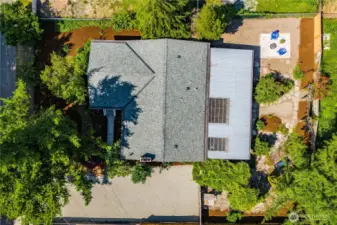This bird's eye view shows the layout of the property, and the size of the covered patio in back. There's greenery all around for beautiful views through each window.