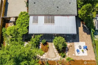 This aerial perspective shows the layout of the backyard of the property.