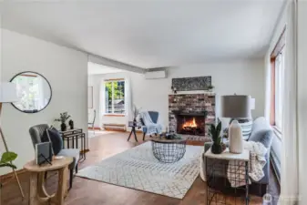 Enter into the living room of the home, where you'll find original hardwoods that extend throughout the main level.