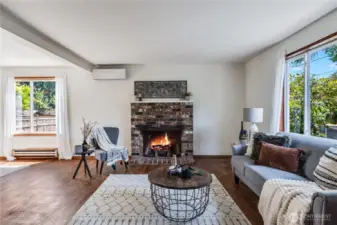 The wood burning fireplace is a cozy centerpiece of the living room.