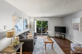 Living room has ample space, newer lvp flooring and electric heat.