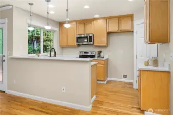Beautiful kitchen with maple cabinets and walk-in pantry