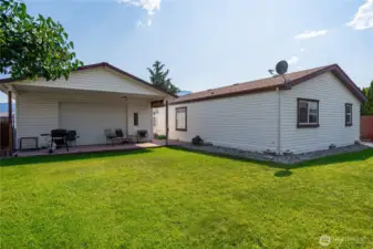 Great manufactured home in the Orchards with a detached double garage and big back yard.