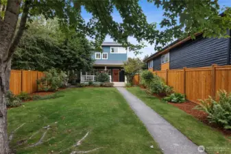 This is the walkup, through a spacious, flat, parklike lot. Room for all kinds of activities, or perhaps another dwelling.