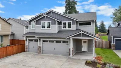 This home has attention to detail throughout, from light fixtures to brick accents.