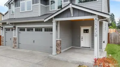 The spacious front entryway is welcoming for guests or to enjoy  the front yard.
