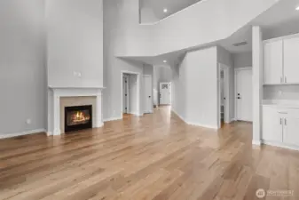 The gas fireplace is a luxurious and comfortable addition to the open concept living room.