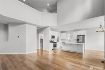 Vaulted ceilings and custom lighting create a bright and open atmosphere.