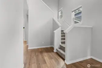 A curved stairway leads you to the upper level bonus area and bedrooms.