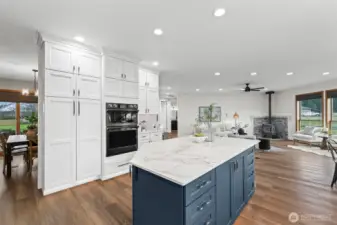 With floor to ceiling white cabinetry, a striking blue island and new high-end appliances it will not disappoint!