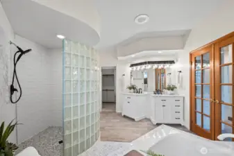 The newly renovated primary bathroom provides a spa-like experience