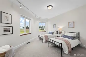 On the opposite wing from the primary you'll find two more bedrooms