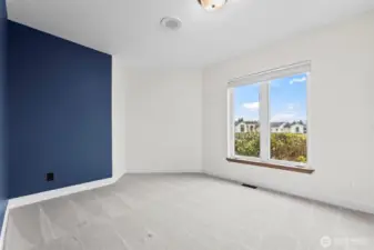 The second of the bedrooms with accent wall in the popular Benjamin Moore color, Hale Navy