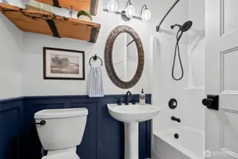 This newly renovated bathroom is both powder and the bath to the adjacent fourth bedroom