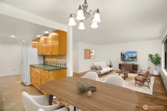 The galley kitchen to the left is open at both ends, and the flow is a circle through the kitchen to the hall, into the living room and back to the dining area.  Cozy yet plenty of space for everyone.