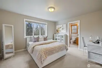 Guest bedroom with private 3/4 bath and walk-in closet.