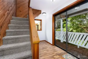 Stairs to second level and back porch