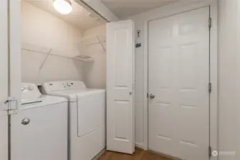 Laundry closet on the main floor next to garage access. Washer & dryer stay!