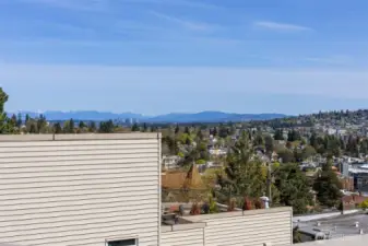 Facing east. Bellevue & The mountains.