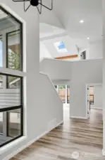 Vaulted entry showcases all the great angles of this original home.