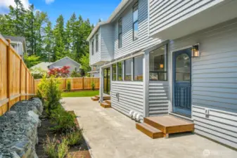 A spacious patio off the kitchen and great room provides the perfect setting for entertaining and outdoor gatherings.