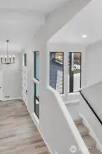 Soaring entry from the upstairs landing.