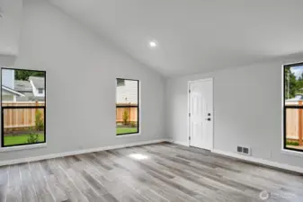 Vaulted ceilings and abundant windows fill this spacious ADU with natural light.