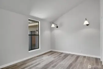 Vaulted ceiling in the ADU bedroom provides a sense of space and architectural interest.