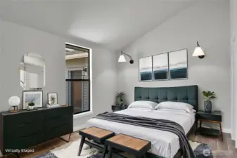 Vaulted ceiling in the ADU bedroom provides a sense of space and architectural interest. Walk-in closet to the right not shown. Virtually staged.