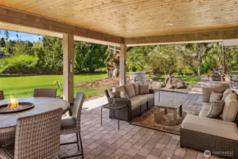 Expansive covered outdoor paver stone back patio-two large sliders as well as French Doors provide easy access.