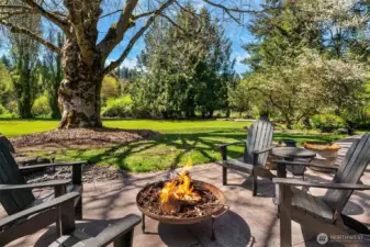 Expansive covered outdoor paver stone back patio-two large sliders as well as French Doors provide easy access.