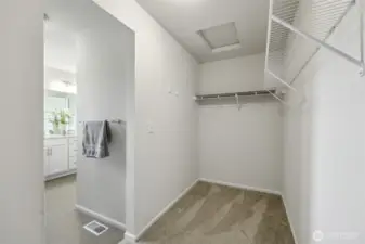 Plenty of room in this walk in closet, with even more storage not pictured.
