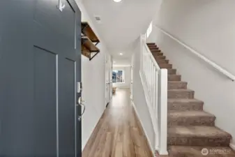 Large entry with stairs leading to the second floor.