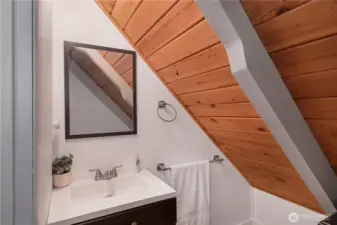 1/2 bath is off the upstairs bedroom.