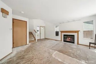 Carpet removed. Seller credit of $5,000 toward carpet replacement.  Gas-log fireplace.