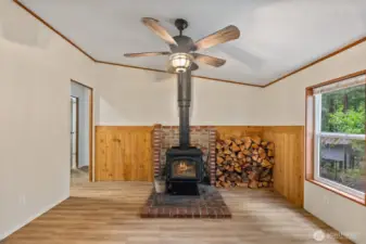 Efficient wood burning stove complete with plent of firewood to start off the cool season.