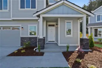 All about curb apeal!  Relax and enjoy the oversized covered front porch with decorative stone panels.