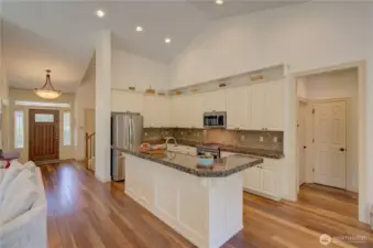 Main entrance, kitchen and hallway to the laundry room and primary suite.