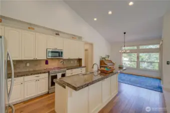 Kitchen and dining room with a sliding door to the covered rear deck.