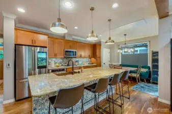 The kitchen has been fully remodeled: New cabinets, slab granite counters, copper sink, all new appliances and new lighting.