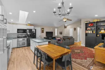Updated Kitchen w/White Cabinets, Stainless and Black Appliances, Quartz Counters and Tile Backsplash