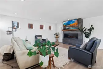 Formal living room with gorgeous tiled fireplace.