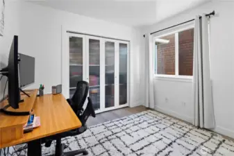 Office doubles as guest room with custom Murphy bed that conveys with the home